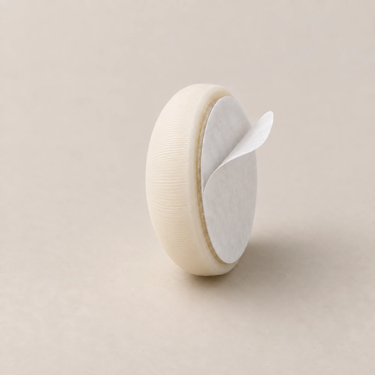 Self-adhesive cabinet door bumper