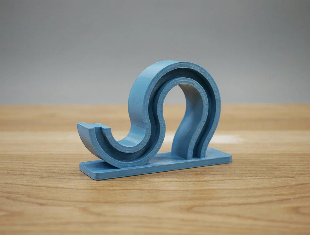 Schoolbag hook for under the desktop